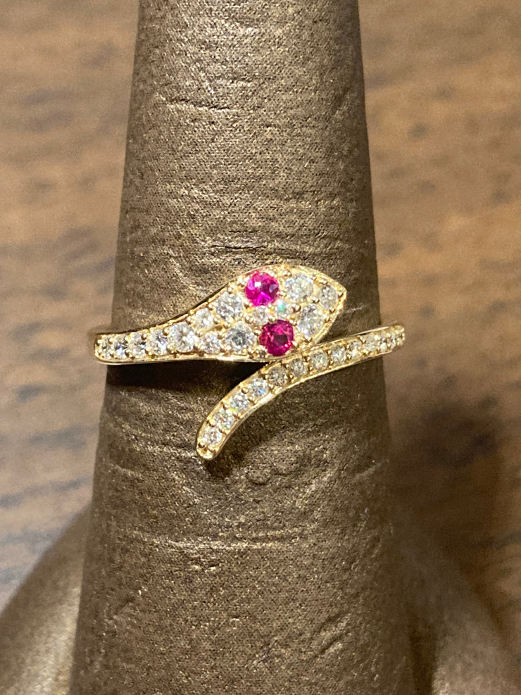 Snake ring with Ruby eyes 0.07cts and diamond accents 0.25cts.